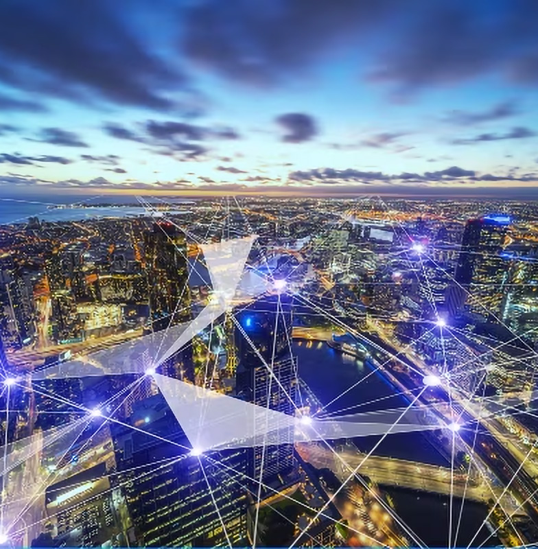 Ariel view of a city at dusk with graphics depicting interconnectivity